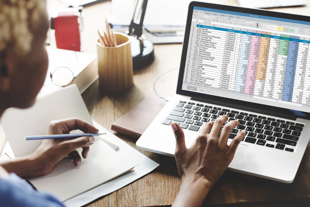 woman working on ACOS on her laptop