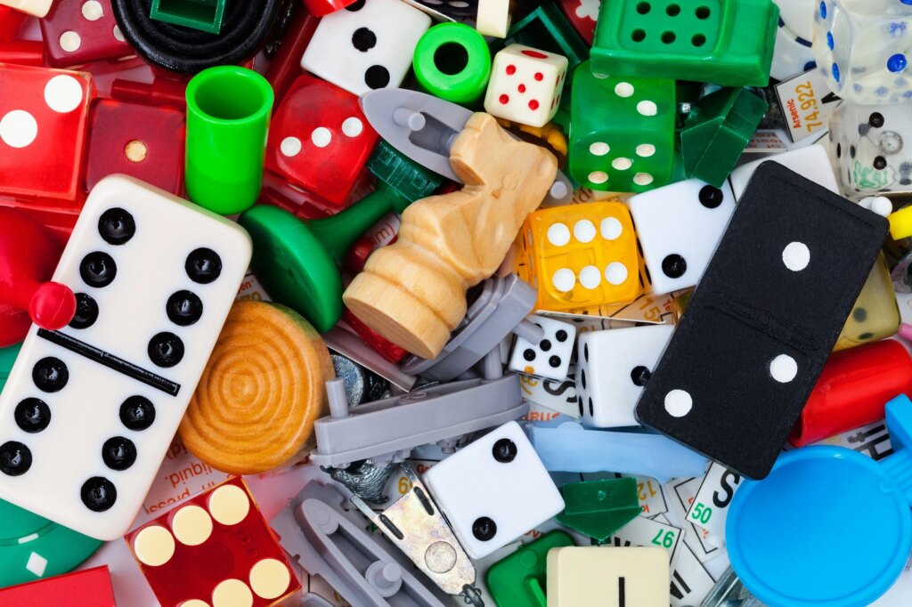 Dice and game pieces for creating an original board game