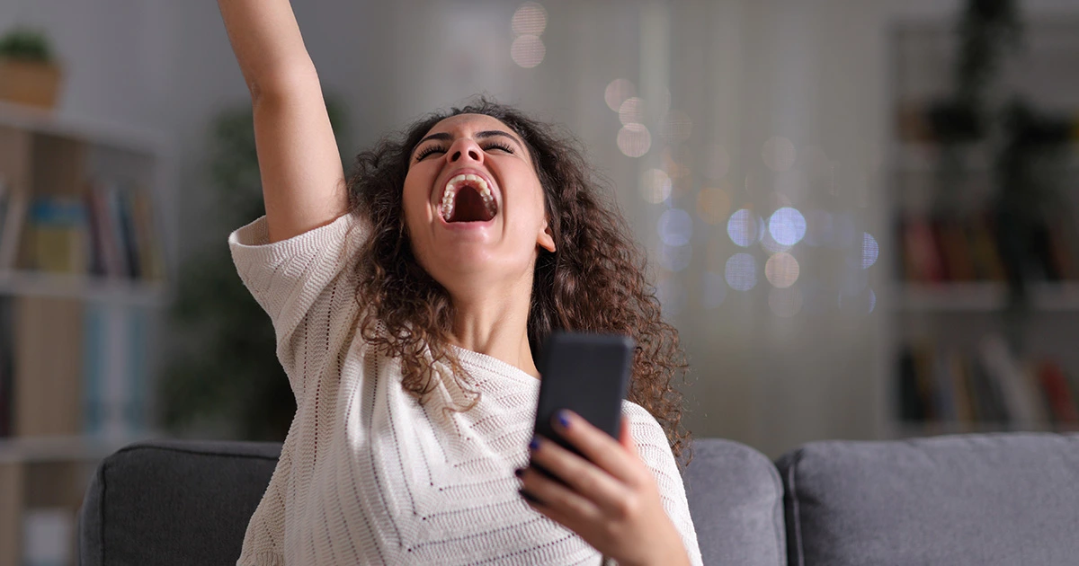 Woman celebrating sales growth selling on Amazon