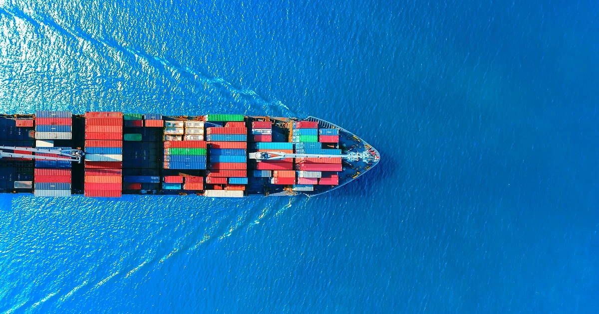 Cargo ship with FCL shipping containers in the ocean