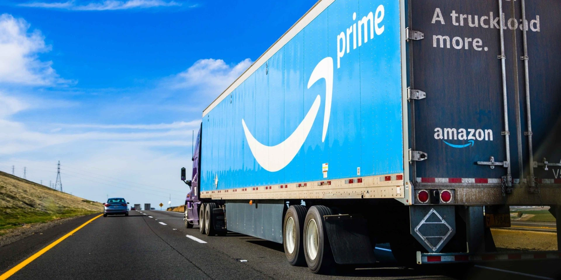 Amazon freight truck driving on freeway