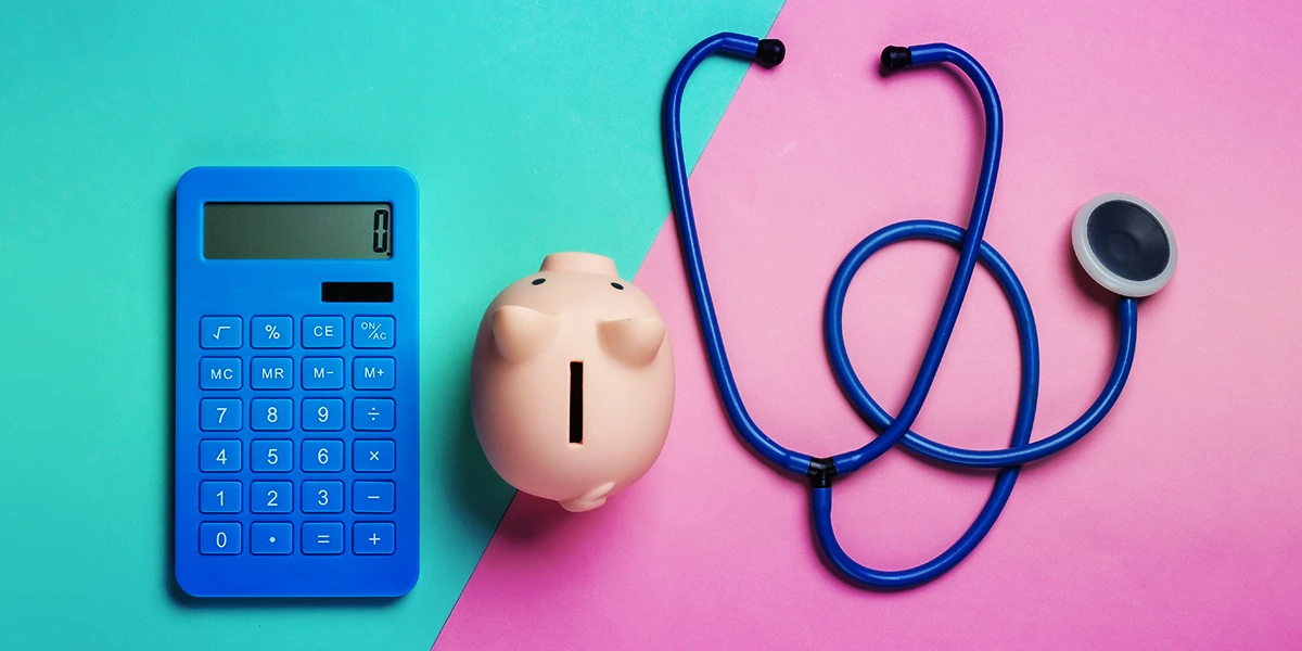 Calculator, piggybank, and stethoscope