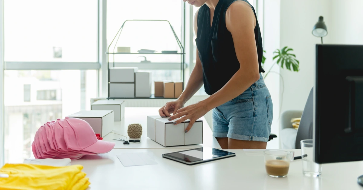 Woman working on Merch by Amazon order