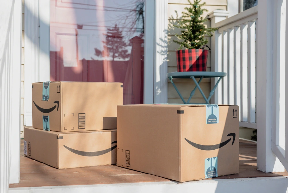 Stack of Amazon packages on doorstep