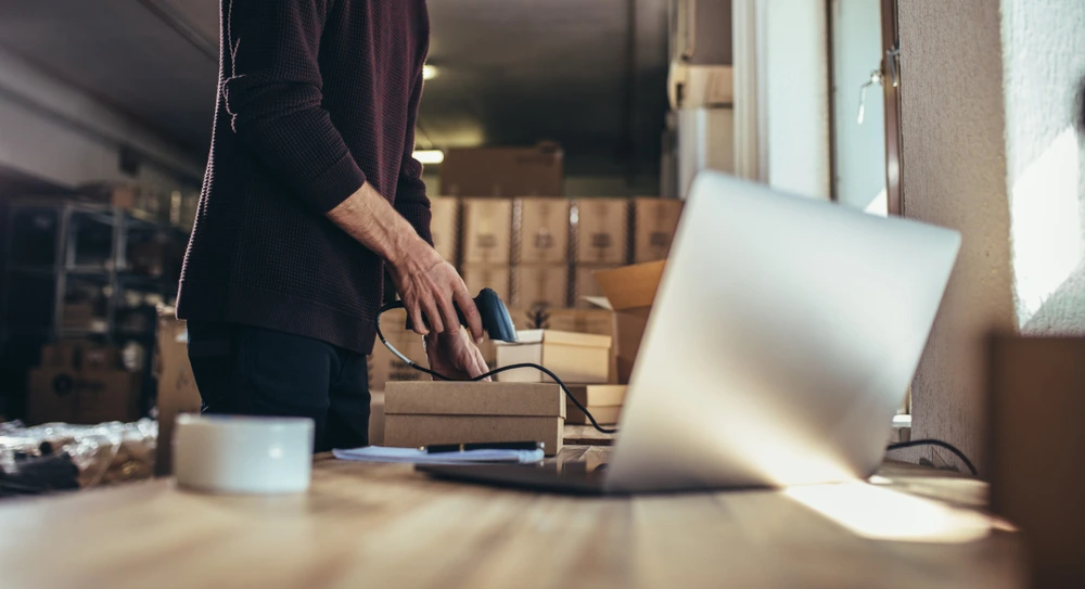 man scanning a package label