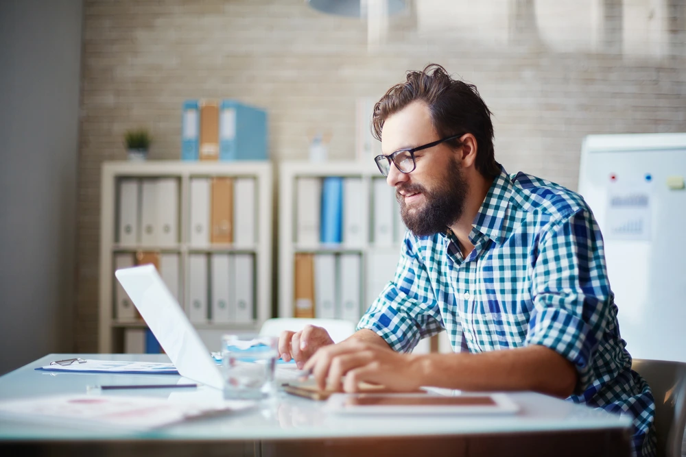 man working on keyword research in his office