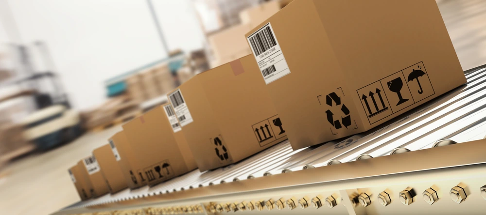 amazon packages rolling down a conveyor belt 