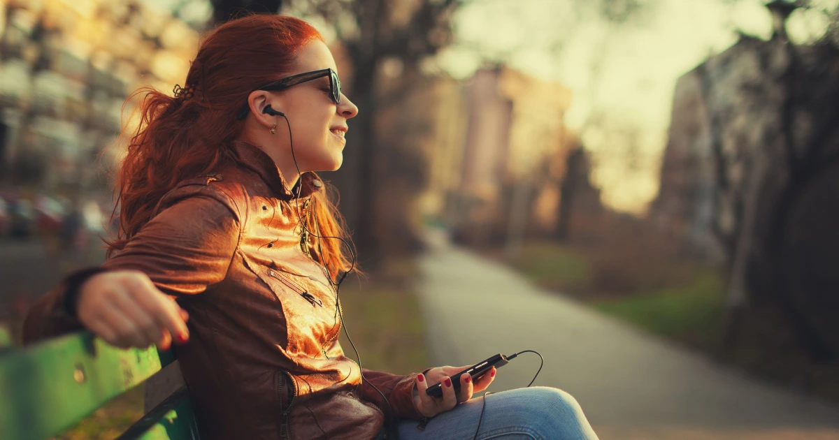 woman listening to earphones